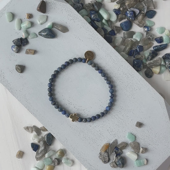 Load and play video in Gallery viewer, Faith Over Fear Cross Bracelet-Lapis Lazuli
